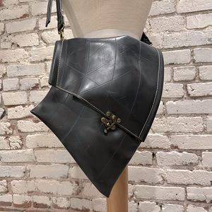 Black deep asymmetrical inner tube cross body bag.